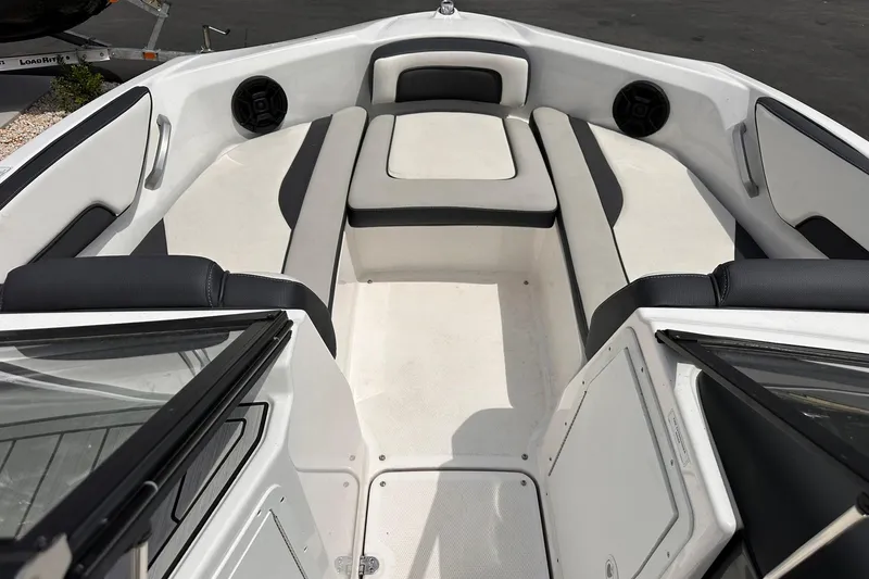 Slide: The Image of 2024 Yamaha Boats AR195 interior with spacious seating and sleek design. - 11