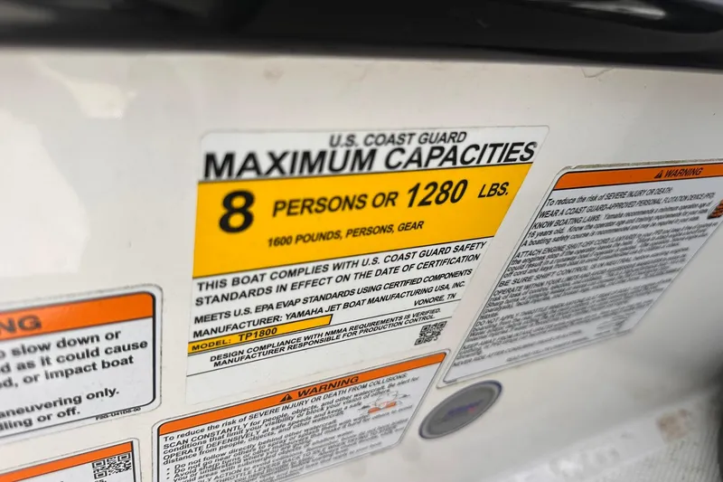 Slide: The Image of 2024 Yamaha Boats AR195 capacity label, 8 persons or 1280 lbs, safety compliance details. - 15