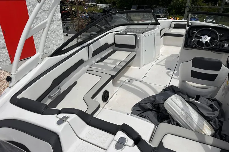 Slide: The Image of 2024 Yamaha Boats AR195 interior with sleek seating and modern dashboard design. - 8