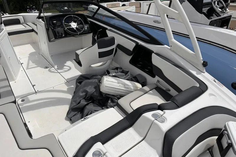 Slide: The Image of 2024 Yamaha Boats AR195 interior with sleek seating and modern steering console. - 9