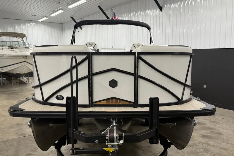 Slide: The Image of 2022 South Bay 523 UL pontoon boat in indoor storage facility. - 2