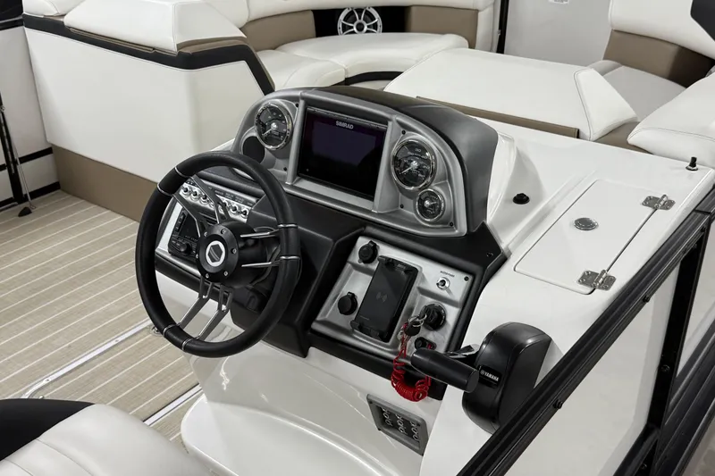 Slide: The Image of 2022 South Bay 523 UL boat dashboard with steering wheel and control panel. - 4