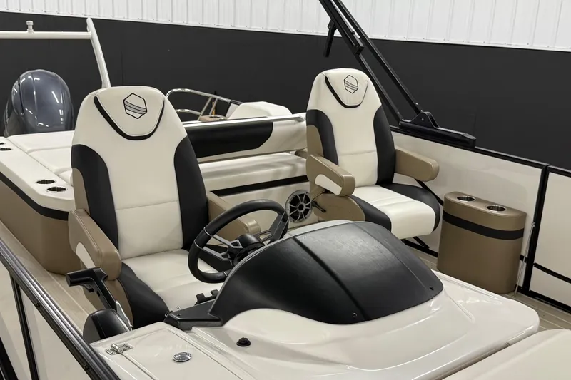 Slide: The Image of 2022 South Bay 523 UL boat interior with dual captain chairs and steering console. - 5