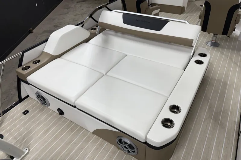 Slide: The Image of 2022 South Bay 523 UL boat interior with cushioned seating and cup holders. - 8