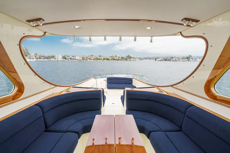 Slide: The Image of Luxurious 2014 Hinckley Talaria 34 yacht interior with elegant seating and scenic water view. - 15