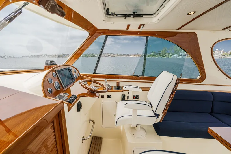 Slide: The Image of Interior of 2014 Hinckley Talaria 34 yacht with elegant helm and panoramic windows. - 19