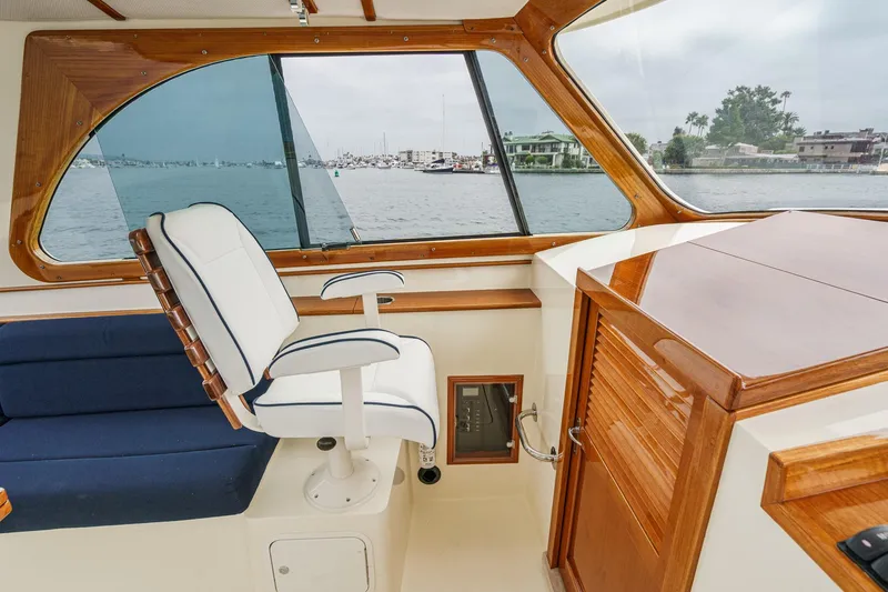 Slide: The Image of Interior of 2014 Hinckley Talaria 34 yacht with elegant wood finish and comfortable seating. - 23