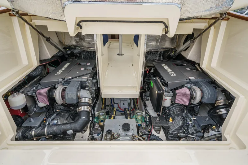 Slide: The Image of Engine compartment of a 2014 Hinckley Talaria 34, featuring dual Yanmar engines. - 36