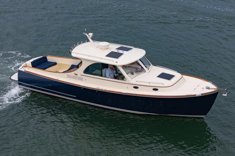 Slide: The Image of 2014 Hinckley Talaria 34 cruising on open water, showcasing elegant design and craftsmanship. - 7