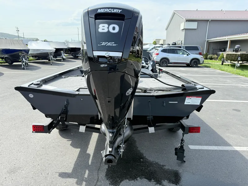 Slide: The Image of 2025 Crestliner XF 189 boat with Mercury 80 engine in parking lot. - 2