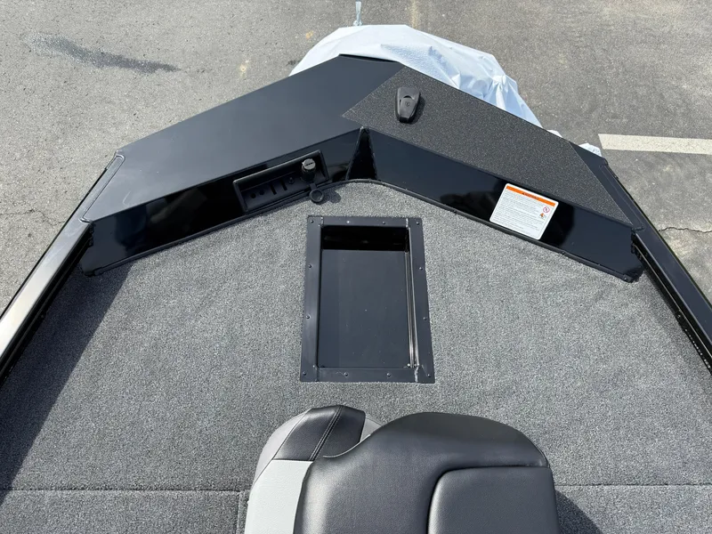 Slide: The Image of 2025 Crestliner XF 189 boat deck with storage compartment and seating. - 3