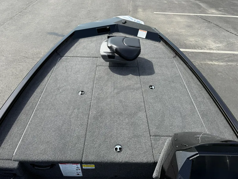 Slide: The Image of 2025 Crestliner XF 189 boat deck with seating, featuring a spacious, carpeted layout. - 4