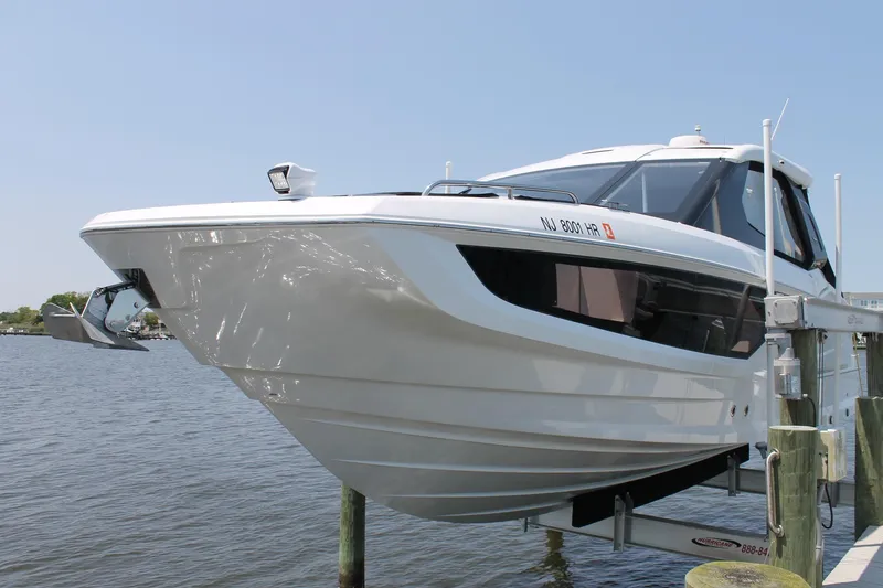 Slide: The Image of 2022 Galeon 325 GTO yacht docked, showcasing sleek design and modern features. - 1