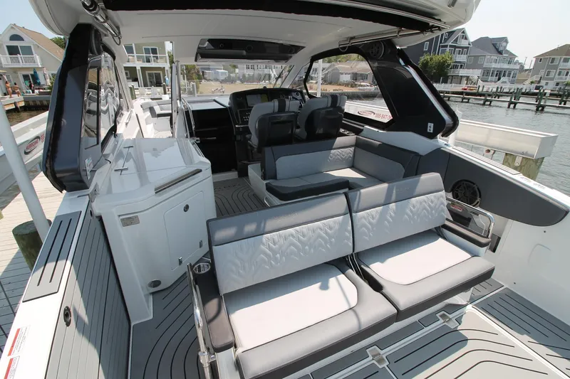 Slide: The Image of 2022 Galeon 325 GTO luxury yacht interior with sleek seating and modern design. - 11