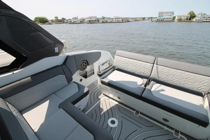 Slide: The Image of 2022 Galeon 325 GTO boat interior with luxurious seating and waterfront view. - 12