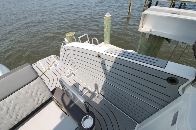 Slide: The Image of 2022 Galeon 325 GTO boat deck with sleek seating and water view. - 14