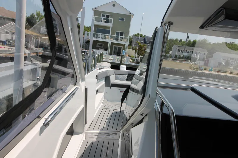 Slide: The Image of 2022 Galeon 325 GTO yacht docked, showcasing sleek design and modern interior. - 19
