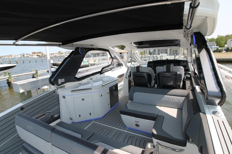 Slide: The Image of 2022 Galeon 325 GTO luxury yacht interior with modern seating and sleek design. - 20