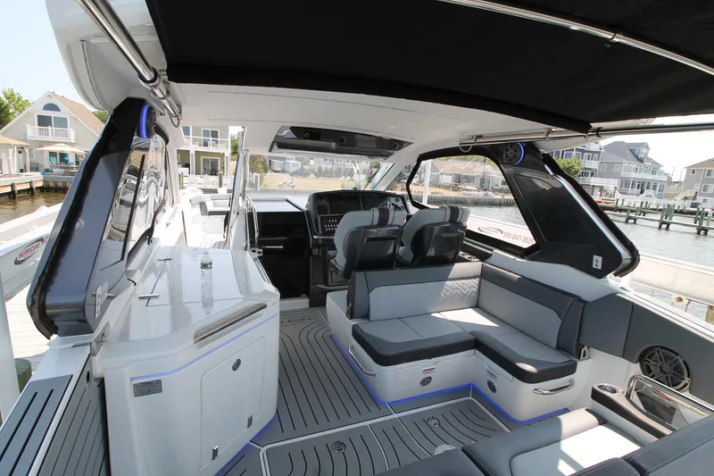 Slide: The Image of 2022 Galeon 325 GTO luxury yacht interior with modern seating and sleek design. - 21