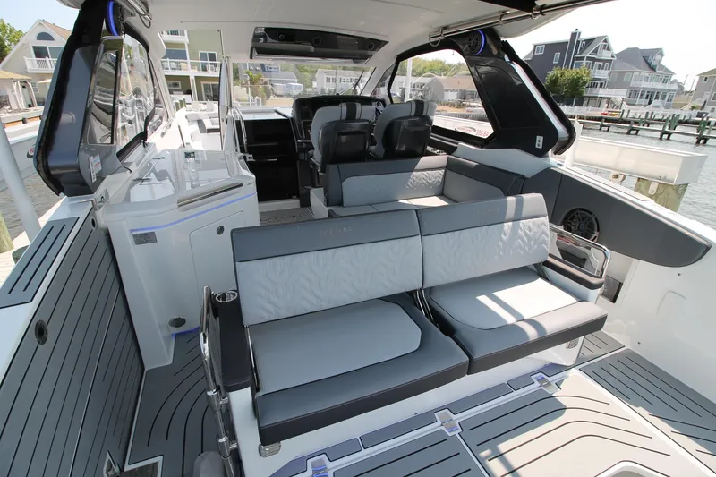Slide: The Image of 2022 Galeon 325 GTO luxury yacht interior with modern seating and sleek design. - 22
