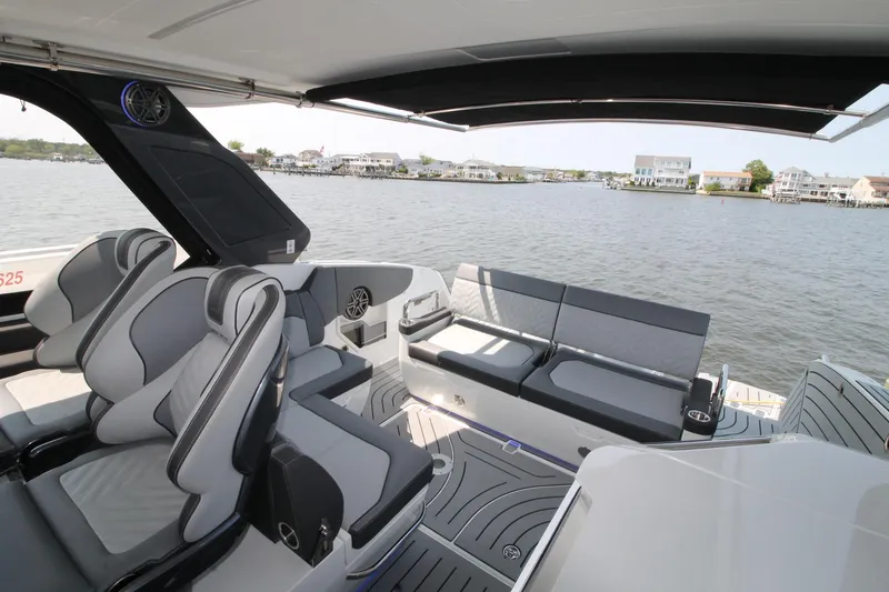 Slide: The Image of 2022 Galeon 325 GTO luxury boat interior with sleek seating and waterfront view. - 23