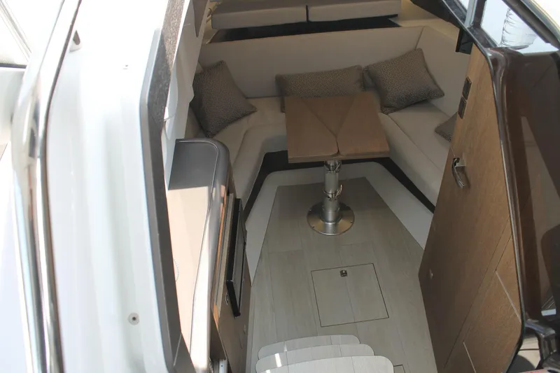 Slide: The Image of Interior of 2022 Galeon 325 GTO yacht with cozy seating and wooden table. - 27