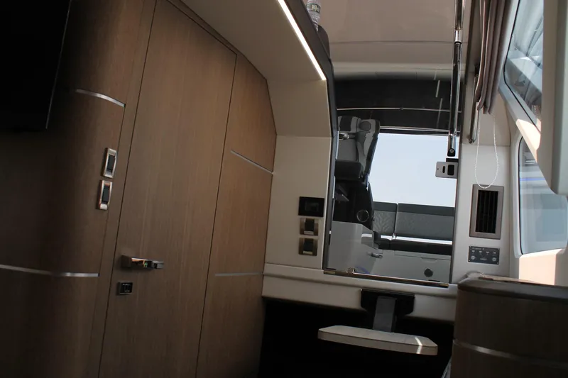 Slide: The Image of Interior of 2022 Galeon 325 GTO yacht, featuring modern wood paneling and sleek design elements. - 31