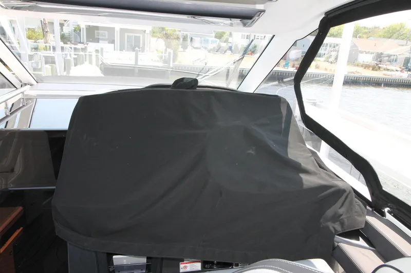Slide: The Image of Interior view of 2022 Galeon 325 GTO boat with covered dashboard. - 5