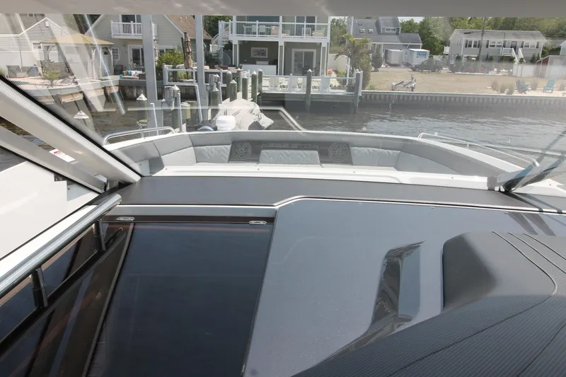 Slide: The Image of 2022 Galeon 325 GTO yacht interior with waterfront view and modern design. - 7