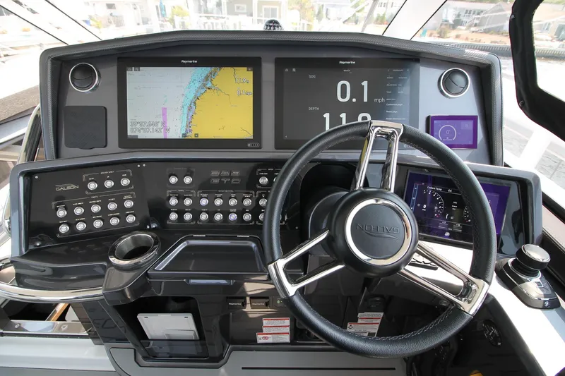 Slide: The Image of Cockpit of 2022 Galeon 325 GTO with advanced navigation displays and controls. - 9