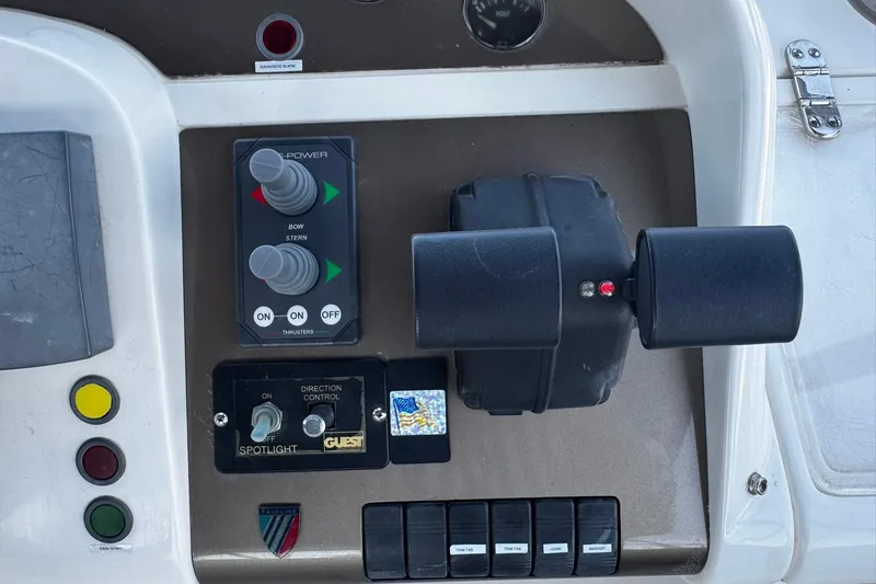 Slide: The Image of Control panel of a 2001 Fairline 55 yacht with thruster and spotlight controls. - 17
