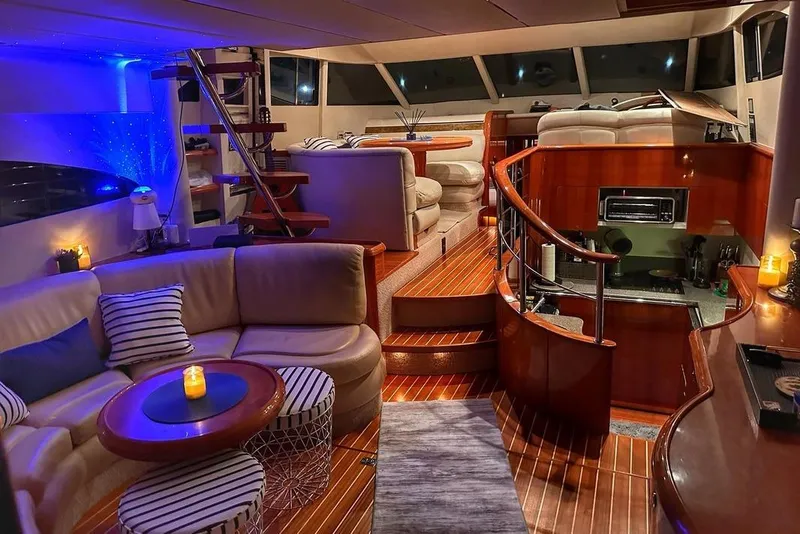 Slide: The Image of Luxurious interior of 2001 Fairline 55 yacht with elegant seating and ambient lighting. - 19