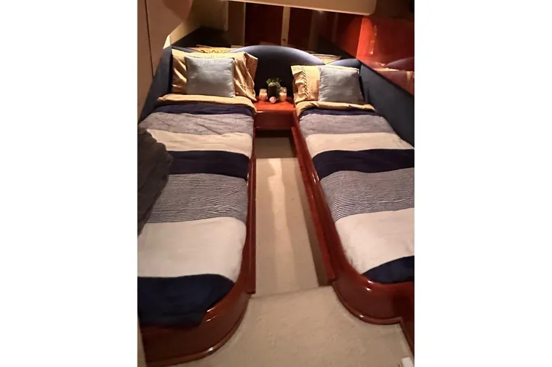 Slide: The Image of Interior cabin of 2001 Fairline 55 yacht with twin beds and cozy decor. - 24