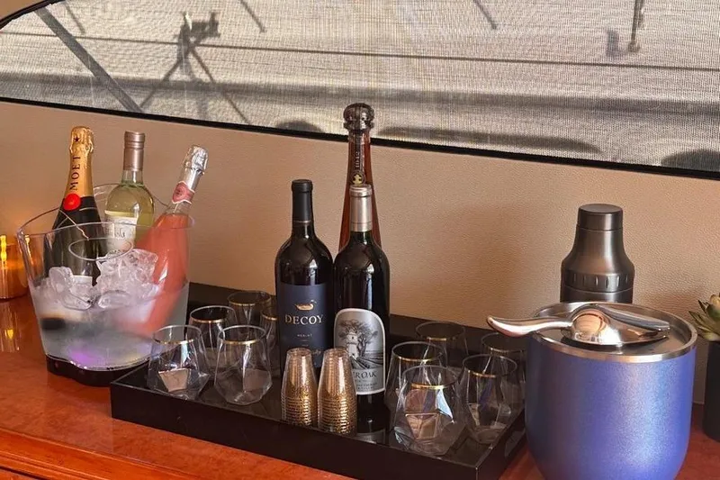 Slide: The Image of Luxury yacht bar setup with wine, champagne, and glasses on a Fairline 55, 2001 model. - 26