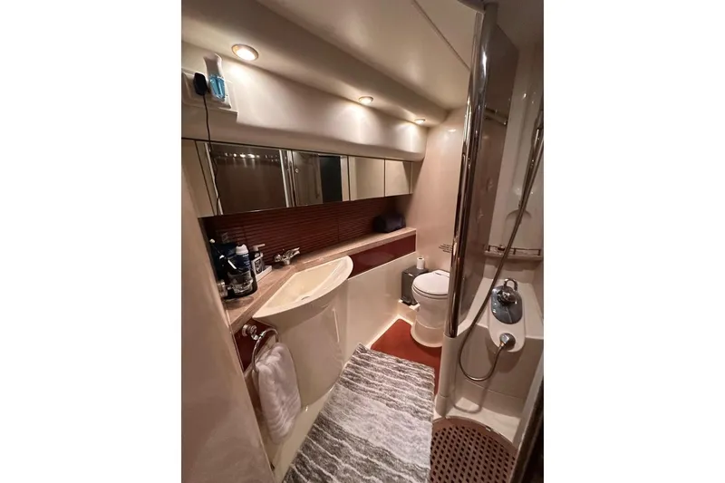 Slide: The Image of Luxurious bathroom in 2001 Fairline 55 yacht with modern fixtures and elegant design. - 29