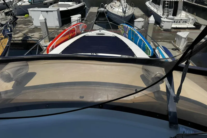 Slide: The Image of 2001 Fairline 55 yacht with surfboards docked at a marina. - 30