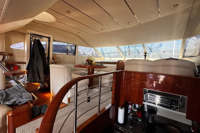 Slide: The Image of Luxurious interior of a 2001 Fairline 55 yacht with elegant seating and wooden finishes. - 34