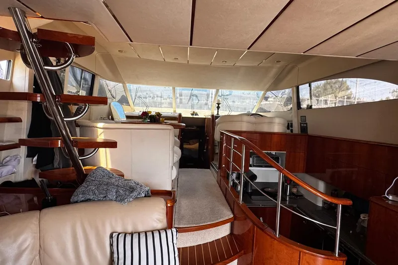 Slide: The Image of Luxurious interior of a 2001 Fairline 55 yacht with elegant wood finishes and modern design. - 37