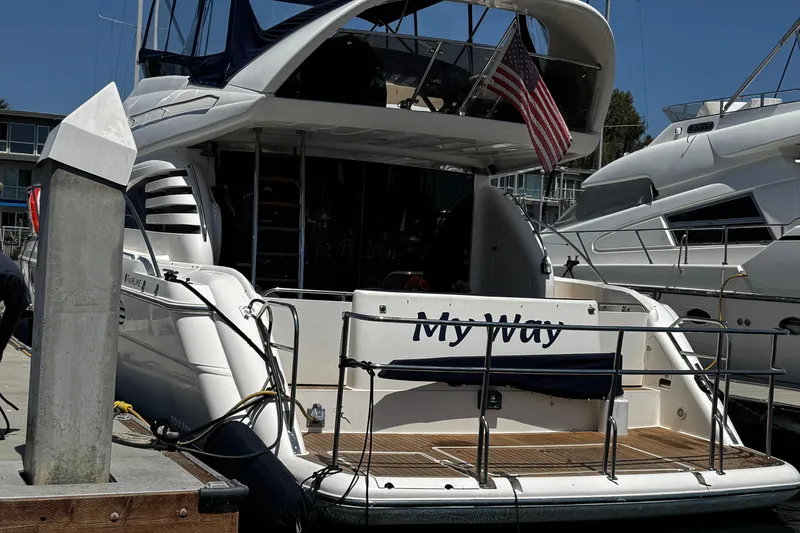 Slide: The Image of 2001 Fairline 55 yacht named "My Way" docked at a marina. - 4