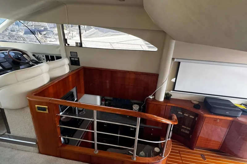 Slide: The Image of Interior of 2001 Fairline 55 yacht with wood finishes and modern amenities. - 41