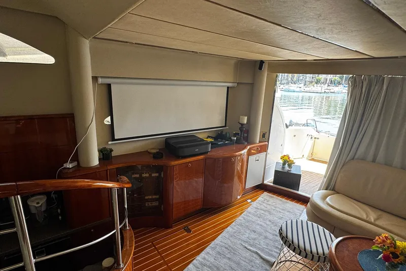 Slide: The Image of Luxurious interior of 2001 Fairline 55 yacht with elegant wood finishes and cozy seating. - 42