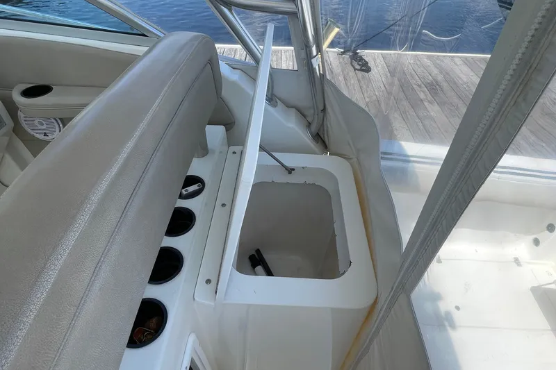 Slide: The Image of 2002 Wellcraft 290 Coastal boat interior with steering wheel and control panel. - 15