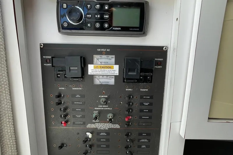 Slide: The Image of 2002 Wellcraft 290 Coastal boat interior with open storage compartment and cup holders. - 17