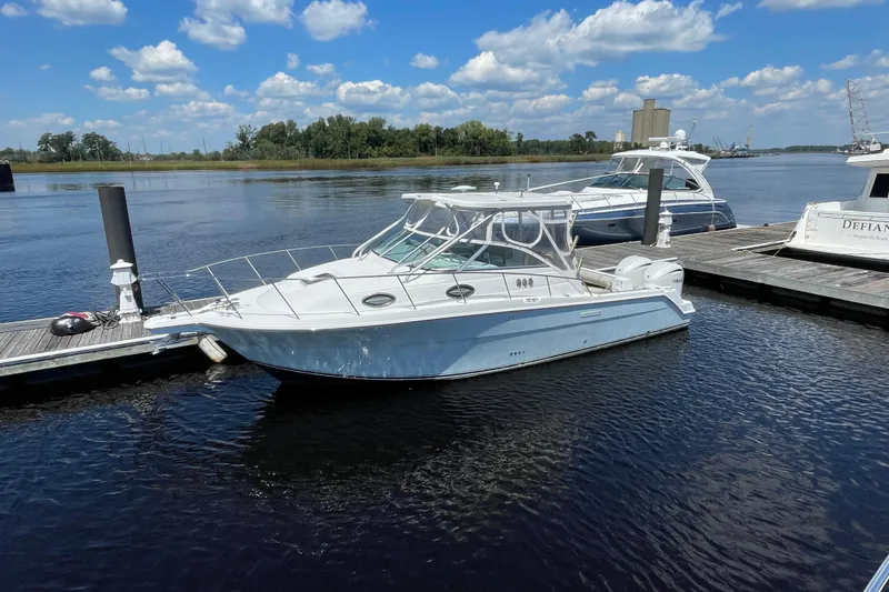 Slide: The Image of 2002 Wellcraft 290 Coastal boat docked with twin 300 V6 engines. - 3