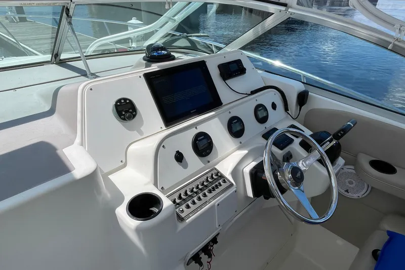 Slide: The Image of 2002 Wellcraft 290 Coastal boat with Yamaha engines docked at a marina. - 7