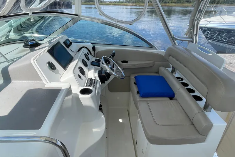 Slide: The Image of 2002 Wellcraft 290 Coastal boat with Yamaha engines docked at marina. - 9