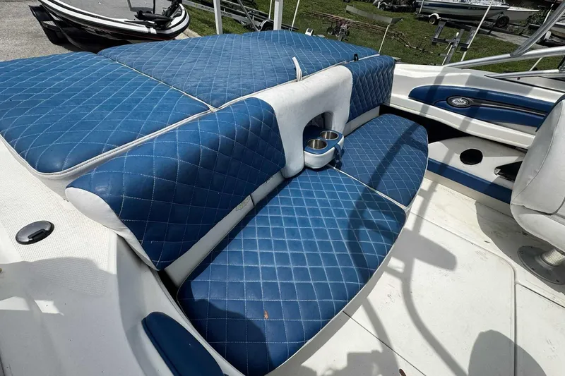 Slide: The Image of 2011 Sea Ray 205 Sport boat with blue quilted seating and cup holders. - 6