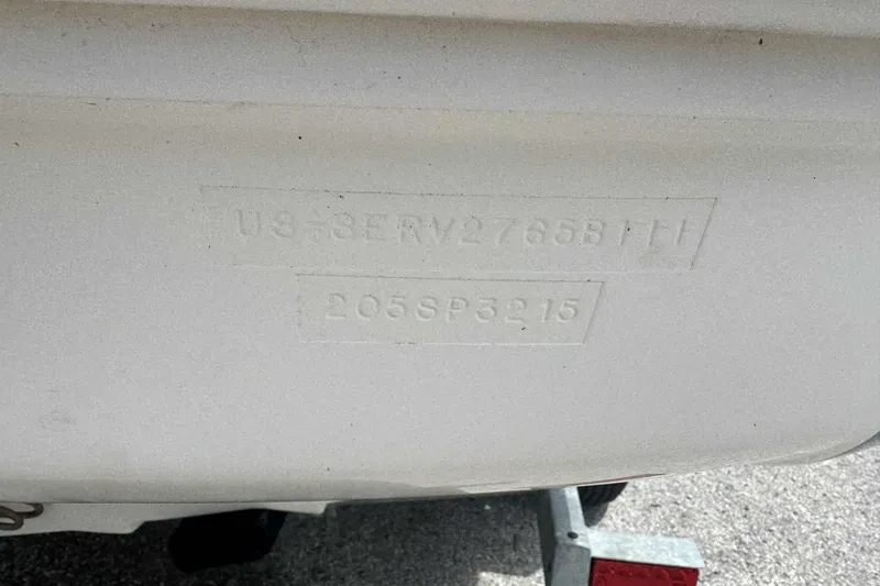 Slide: The Image of 2011 Sea Ray 205 Sport boat hull identification number on white surface. - 8