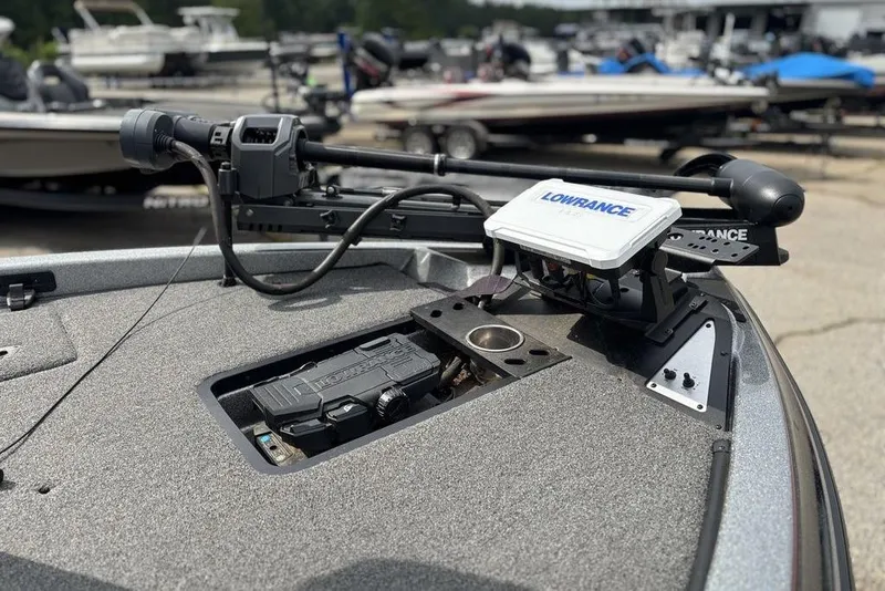 Slide: The Image of 2023 Caymas CX 19 boat with Lowrance electronics and trolling motor, docked at marina. - 14