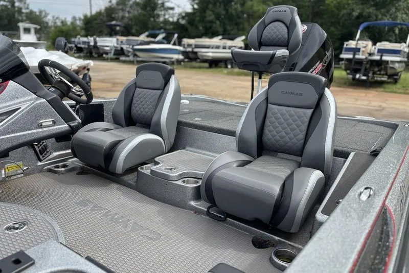 Slide: The Image of 2023 Caymas CX 19 boat interior with sleek, modern seating and steering wheel. - 4